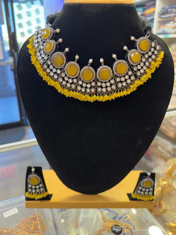 women's necklaces for gifting -Amazing Yellow Stone Studded German Silver Oxidized Necklace And Earrings With Yellow Pearls Drop