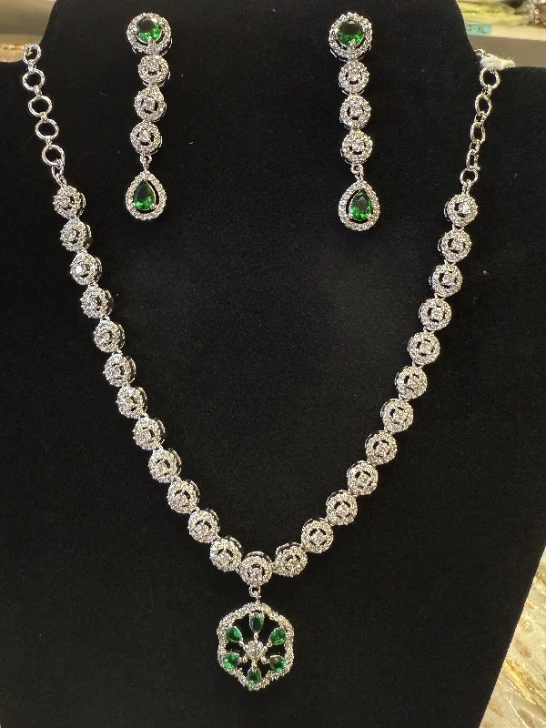 women's necklaces with crystal accents -Alluring American Diamond Green Stoned Necklace With Earrings