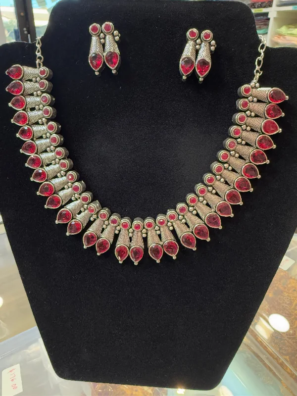 women's necklaces with intricate detailing -Alluring Magenta  Color Studded Design Silver Toned Oxidized Necklace Set With Earrings